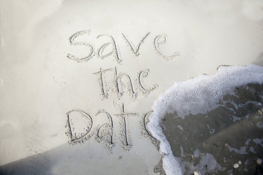 save the date, in sand - Powered by Adobe