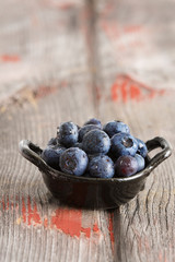 Bowl of fresh ripe autumn blueberries