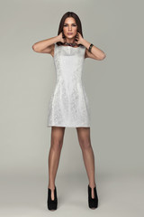 Young model posing in silver dress