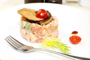 salad, fish and eggs decorated with greens and tomatoes
