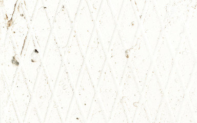 Rusty corrugated metal surface painted with white paint