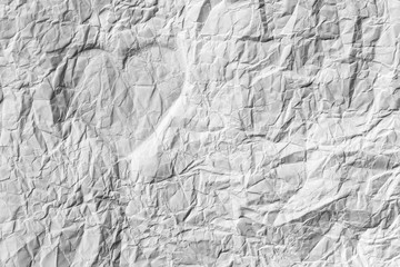 Silhouette of the heart on a white crumpled paper