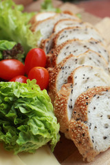 bread sprinkled with sesame -  vegetable green salad