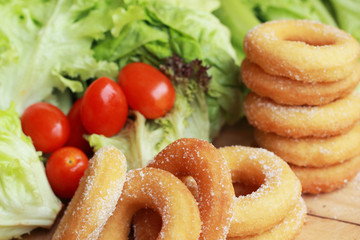 donut and sugar - fresh vegetable salad.