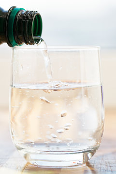mineral water pouring into glass
