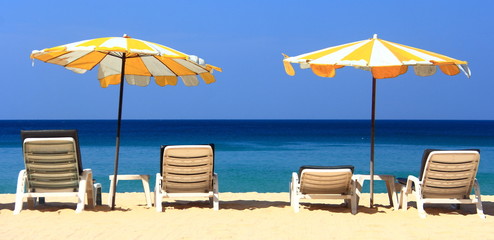 clear blue sky with beach umbrella