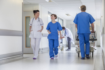 Doctors Hospital Corridor Nurse Pushing Gurney Stretcher Bed