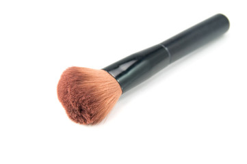A makeup brush on white background