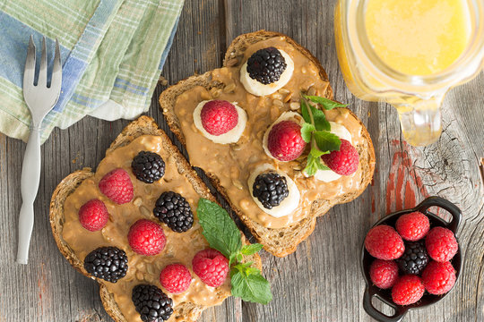 Peanut butter sandwiches with berries and cheese