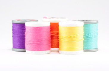 Five spools of sewing thread