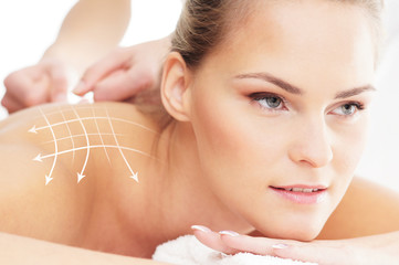 A beautiful and healthy woman getting alternative massage