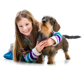 happy little girl with her ​​dachshund