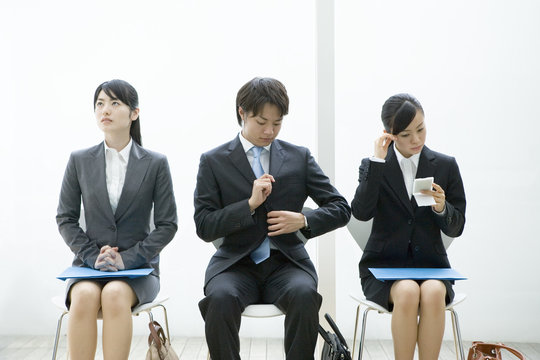 men and women waiting for their turn for interview