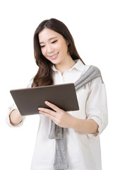 Fototapeta premium Asian young woman using pad