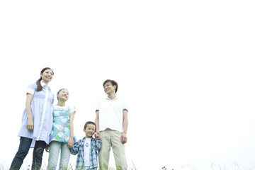 smiling family holding hands
