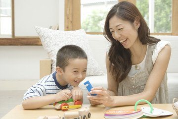 mother and son playing with toy