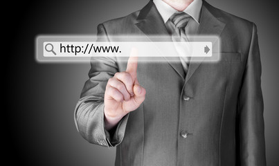 Businessman pushing virtual search bar