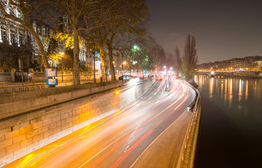 Fototapeta na wymiar Paris streets along Seine river at night