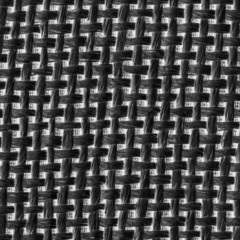 white-black background of interwoven plastic ribbons