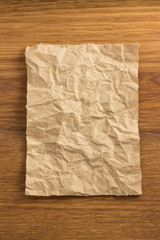 wrinkled paper  on wood