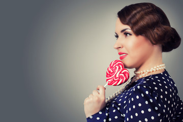 woman with big lollipop in retro style