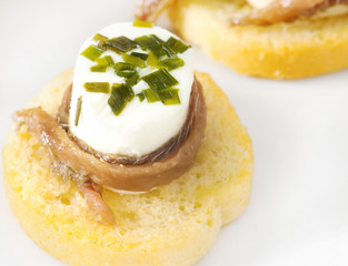 canapè with anchovy and cheese with spices