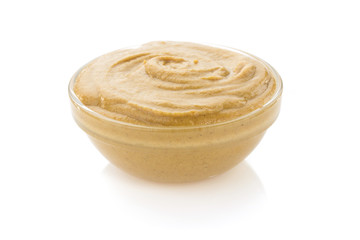 mustard sauce in bowl on white