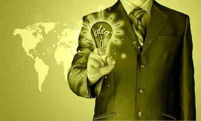 Business man touching light of idea