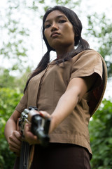 Asian woman armed