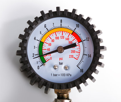 A Compressor Pressure Gauge On A White Background