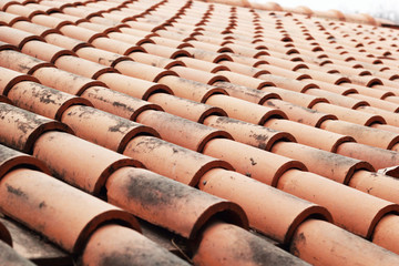 Close up of red roof tiles.