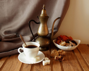 Cup of coffee, vintage coffee pot and figs.