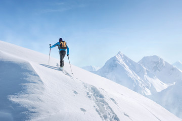 Naklejka na ściany i meble Touring skier in the alps