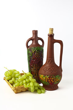 clay bottles and grapes