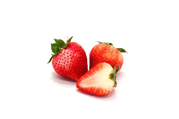 Fresh ripe strawberries and  slice on white background