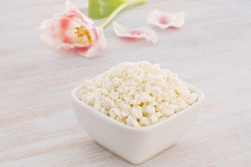 Cottage cheese with pink and white tulip