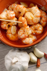Spanish tapas dish, sizzling prawns with chili and garlic