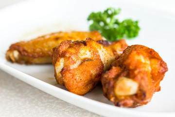 Chicken wings BBQ on a white plate