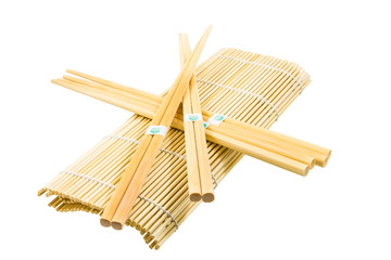 Wooden chopsticks lying on the rug for Sushi