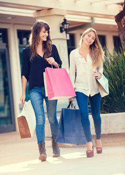 Two young women shopping at the mall