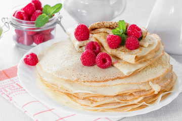 Homemade pancakes with raspberries and mint