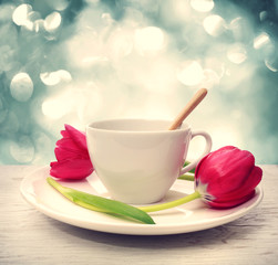 Coffee cup with red tulips