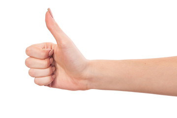 Female hand showing thumbs up sign isolated on white