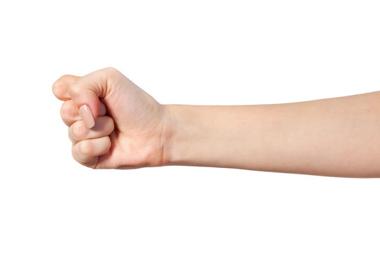 Female hand with a clenched fist isolated