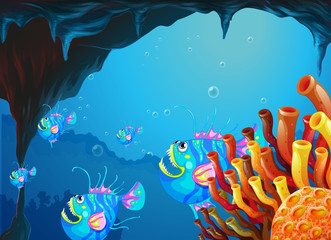 Fototapeta na wymiar A cave under the sea with a school of fish