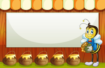 Fototapeta premium A bee with a pot standing in front of the empty template