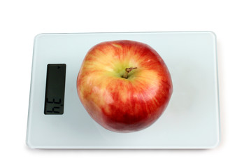 Big apple on scales
