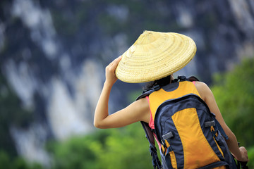 woman hiker hiking in the guilin scenery,china