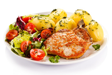 Grilled steak, boiled potatoes and vegetable salad