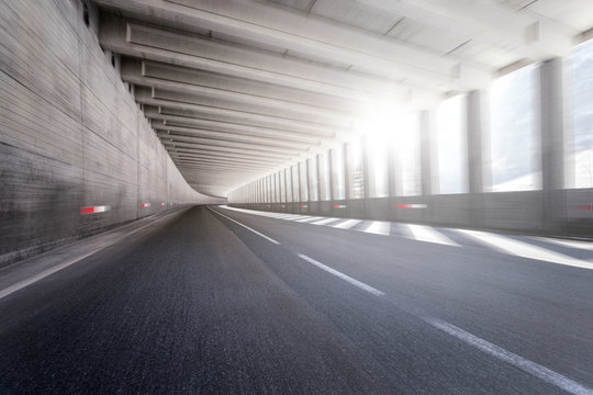 Fototapeta Empty tunnel road with motion blur